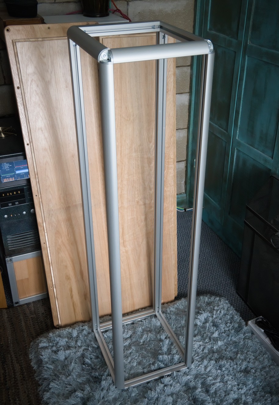 The aluminium extrusions form a tall box shape when connected together.