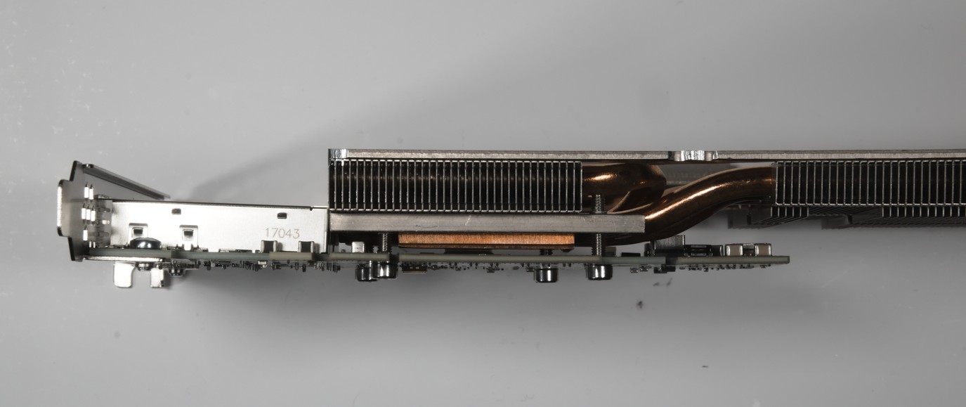 A side view of the heatsink attached to the card. The copper base lies flat against the controller chip.