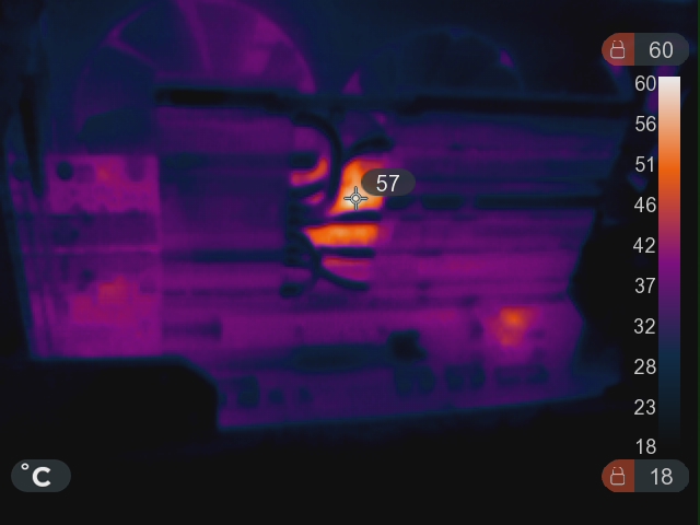 An infra-red image of the card while running. Most of it appears cool, except a glowing orange patch on the right edge of the card, underneath the new heatsink.