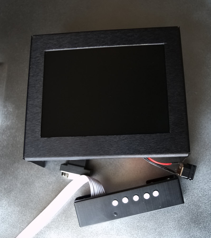The monitor mounted on the drive bay cover
